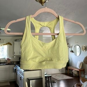 Lululemon sports bra. Yellow. Size 6. Decently worn. Color is slightly duller.